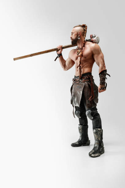istock Man in leather viking's costume isolated on white studio background 1150525866