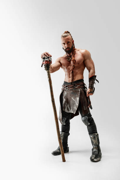 istock Man in leather viking's costume isolated on white studio background 1150525872