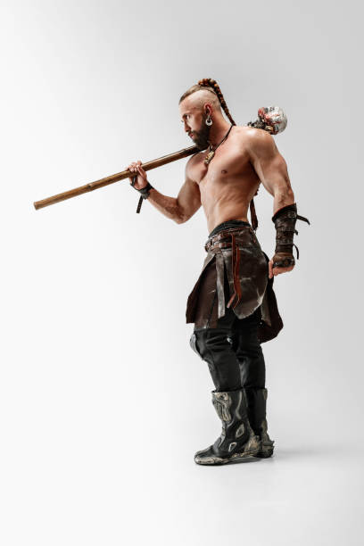 istock Man in leather viking's costume isolated on white studio background 1150525873