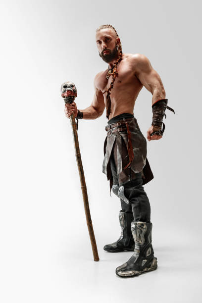 istock Man in leather viking's costume isolated on white studio background 1150525876