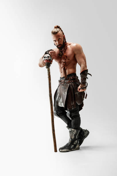 istock Man in leather viking's costume isolated on white studio background 1150526003