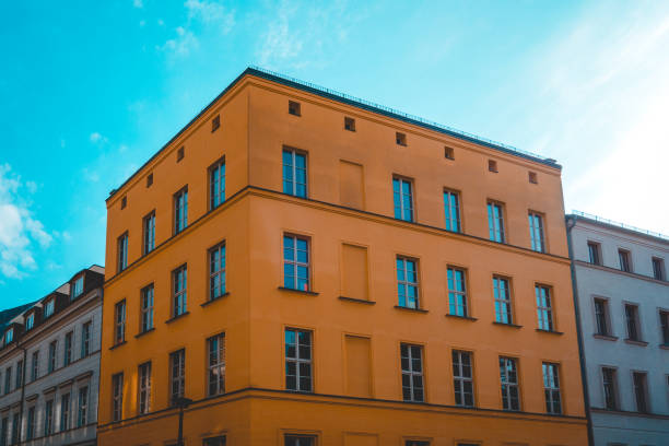 istock orange corner house at berlin with blue sky on the top 1150526852