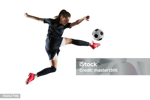 istock Female soccer player kicking ball isolated over white background 1150527186
