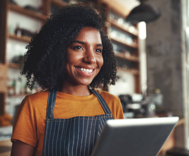 istock A smiling female cafe owner with digital tablet 1150528133