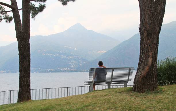 istock man looking at view of Lake Como Italy 1150530123