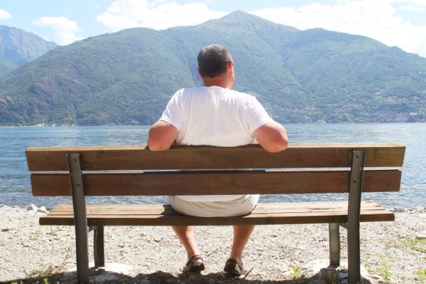 istock man looking at view of Lake Como Italy 1150530250
