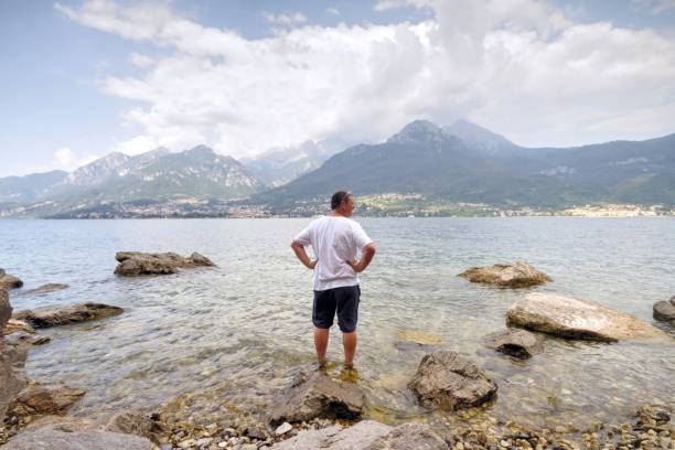 istock man looking at view of Lake Como Italy 1150530266