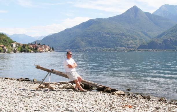 istock man looking at view of Lake Como Italy 1150530319
