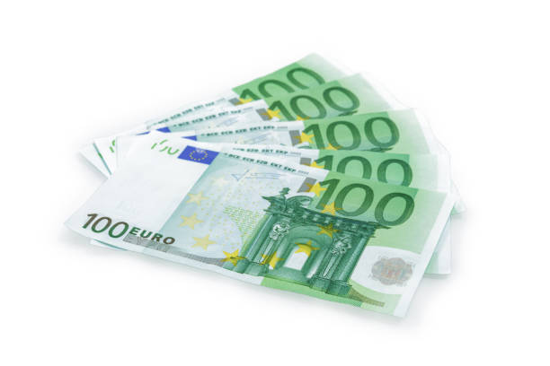 istock Group of 100 Euro banknotes isolated on white background. 1150530662