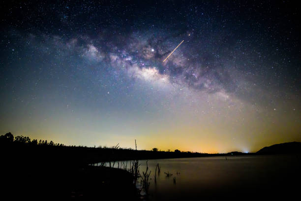 istock Milky way at the lake view in night time 1150531713