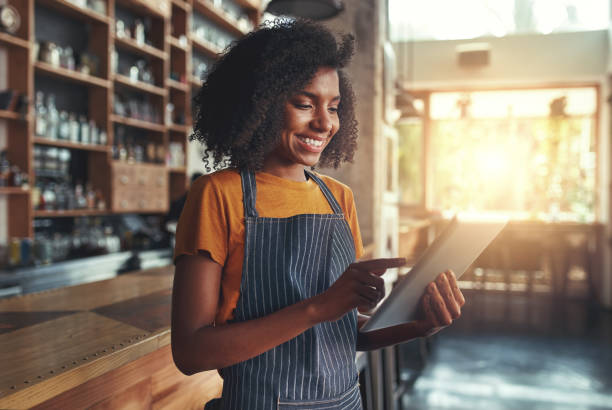 istock Woman barista take order with tablet 1150531775