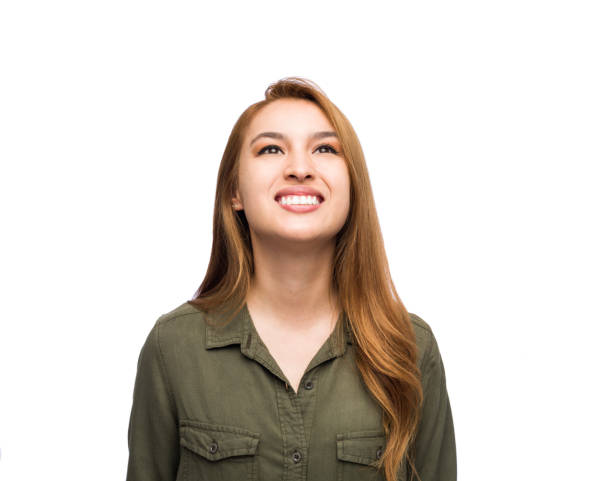istock Young woman smiling while looking upward 1150531976