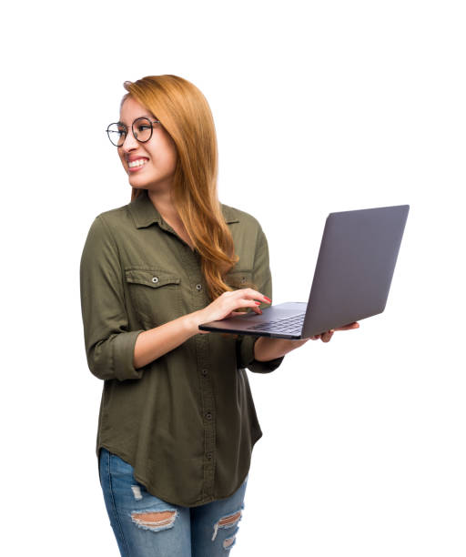 Happy woman with a laptop turning back stock photo