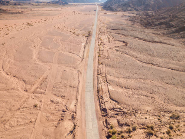 istock Old Desert road with cracked asphalt 1150532956