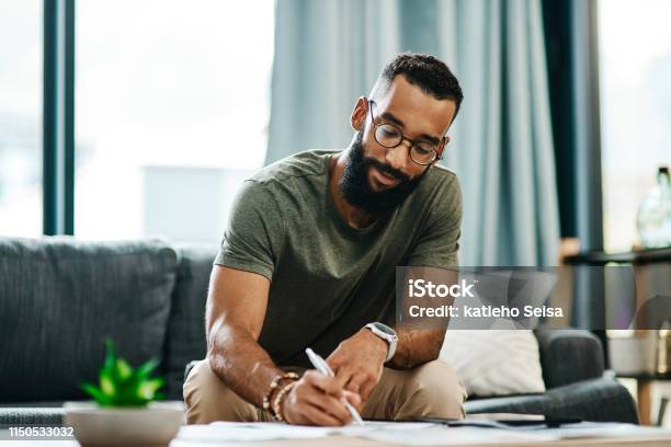 He Knows Exactly Where His Money Goes Stock Photo - Download Image Now - Writing - Activity, Men, People