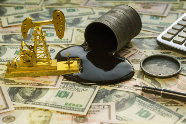 Neftekachka, a barrel of oil on the background Neftekachka, a barrel of oil on the background of banknotes of American dollars. oil and petroleum products market. opec stock pictures, royalty-free photos & images