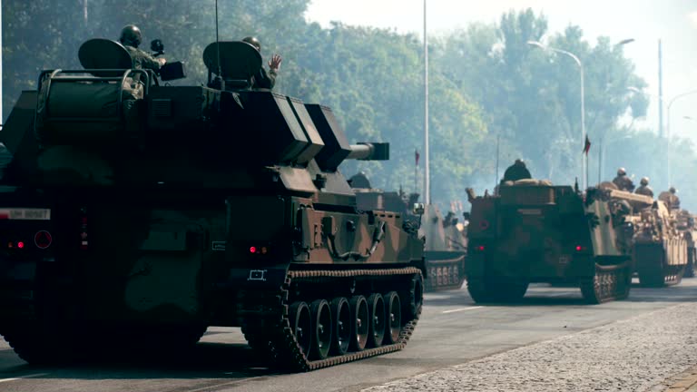 Tanks riding along city streets