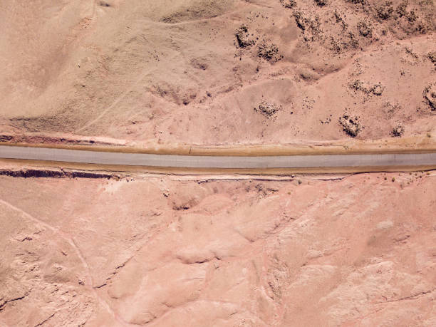 istock Old Desert road with cracked asphalt 1150536356