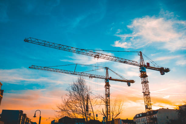 istock industrial cranes at berlin with dramatic sky in the background 1150536729