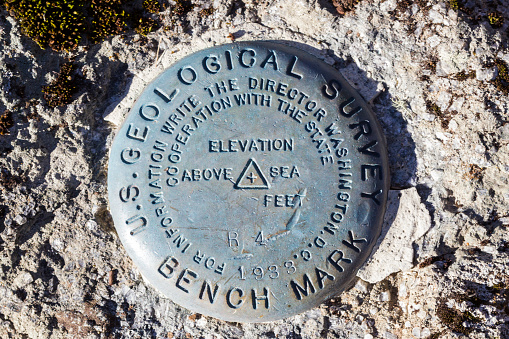 U.S. Geological Survey marker at Devils Tower National Monument in Wyoming, USA.