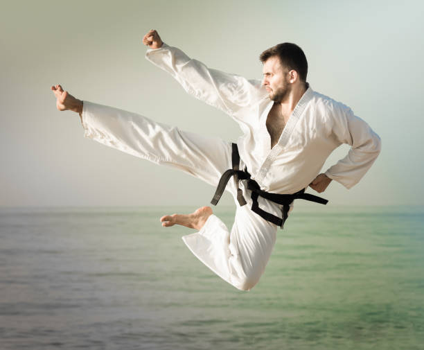 istock Young man shows his skills in karate 1150538081
