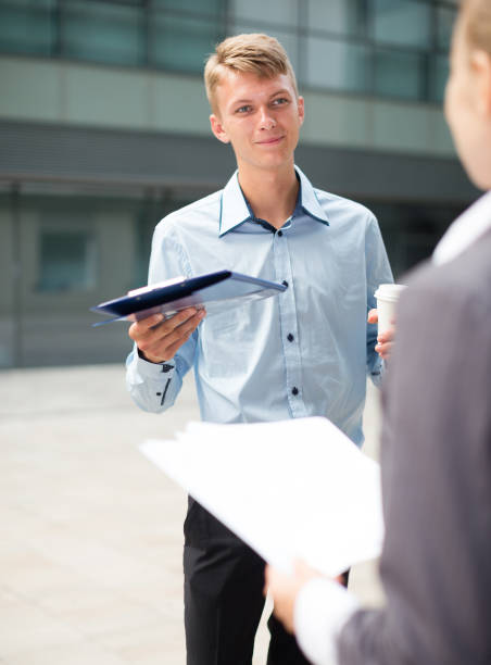 istock Male is talking with partner before signing contract 1150538366