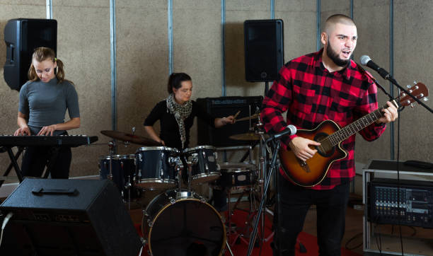 istock Emotional guy with guitar rehearsing 1150538796
