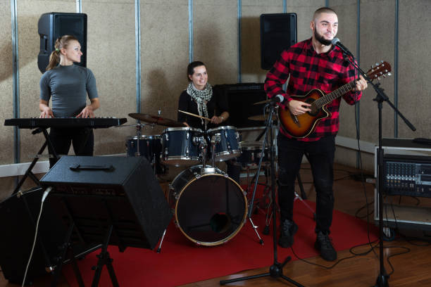 istock Emotional guy with guitar rehearsing 1150538798