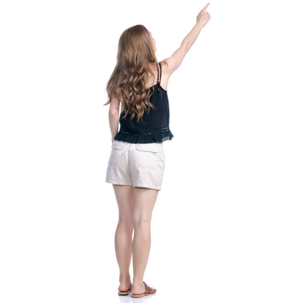 istock Woman in shorts standing looking showing pointing 1150540699
