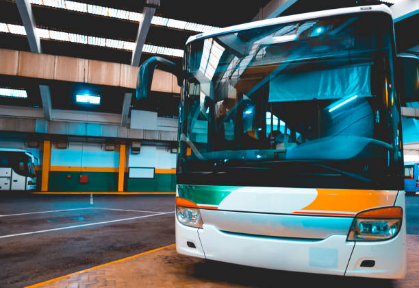 istock holiday bus at station without logos 1150541998