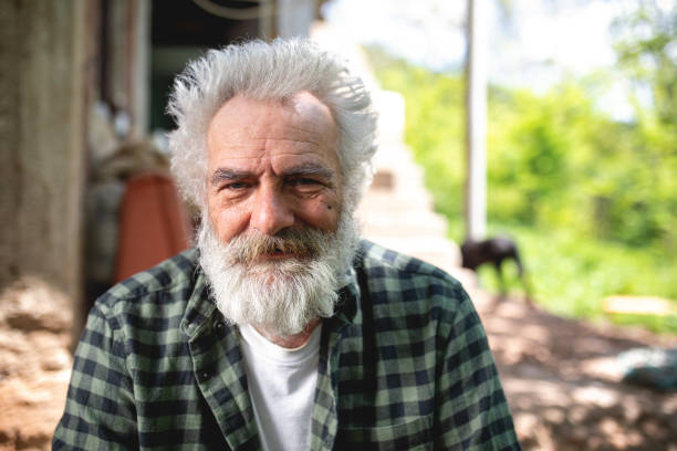 istock Cheerful bearded senior man smiling 1150542015