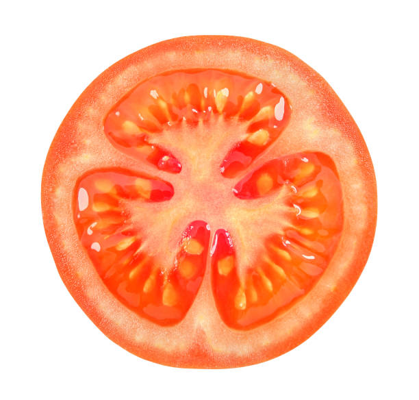 istock Red tomato cut across isolated on white background with clipping path. 1150543496