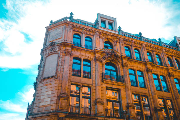 istock orange residential corner building with ornamental facade 1150544039