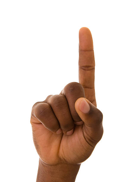 istock Dark skinned person pointing upwards with index finger 115054453