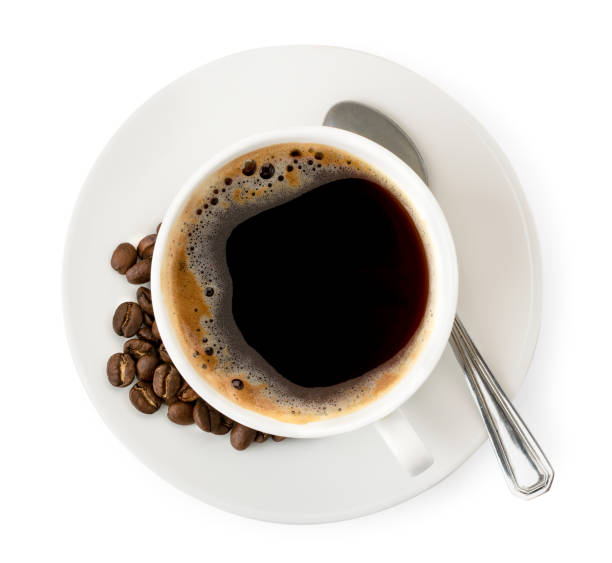 istock Cup of coffee with beans and spoon on a white. The form of the top. 1150544607