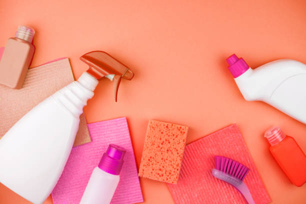 istock House cleaning products are on coral background. 1150545013