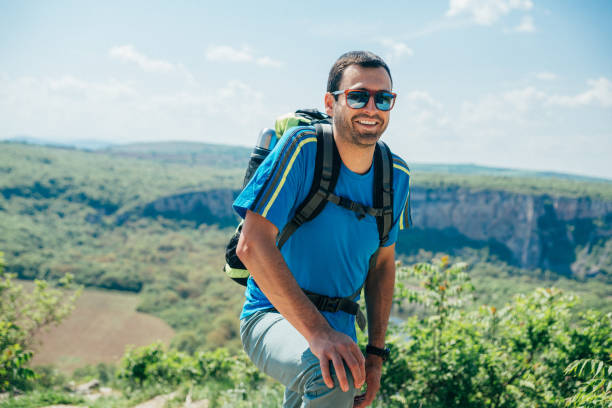 istock Smiling male hiker in the mountain 1150546037