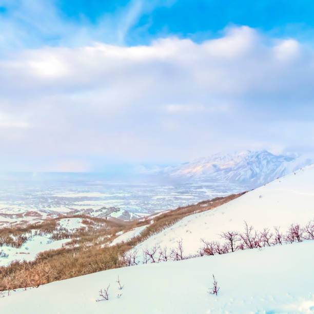 istock Square Panoramic view of a stunning snowy mountain against vibrant sky with clouds 1150549114