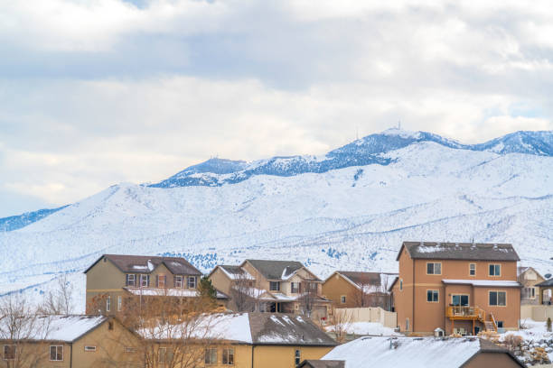 istock Town built on a mountain blanketed with fresh snow against cloud filled sky 1150549326