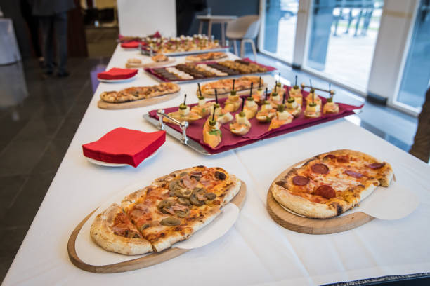 istock Banquet table with pizzas and sandwiches. 1150549707