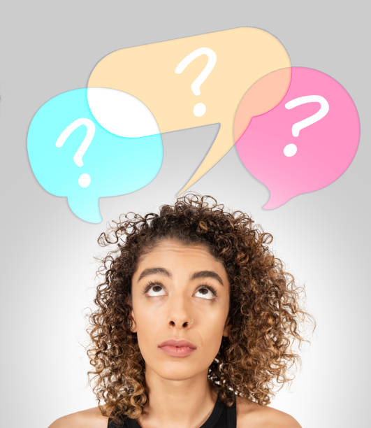 istock Confused woman with question marks 1150550224