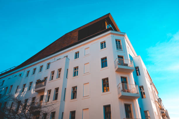 istock white apartment corner building with modern rooftop 1150552497