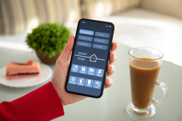 istock female hand holding phone with app smart home on screen 1150552816