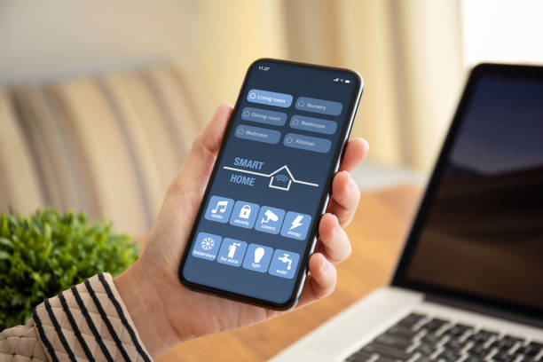 istock female hand holding phone with app smart home on screen 1150552946