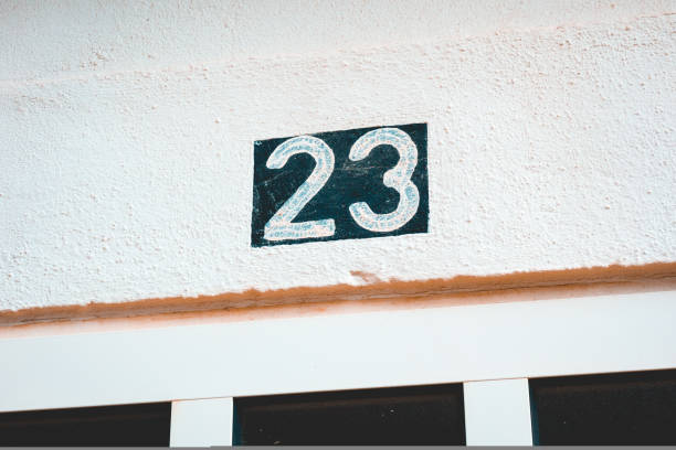 istock blue number 23 door sign on white background 1150553147