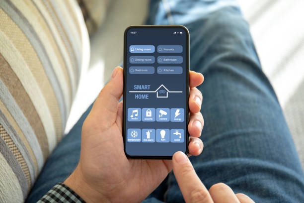 istock male hands holding phone with app smart home on screen 1150553151