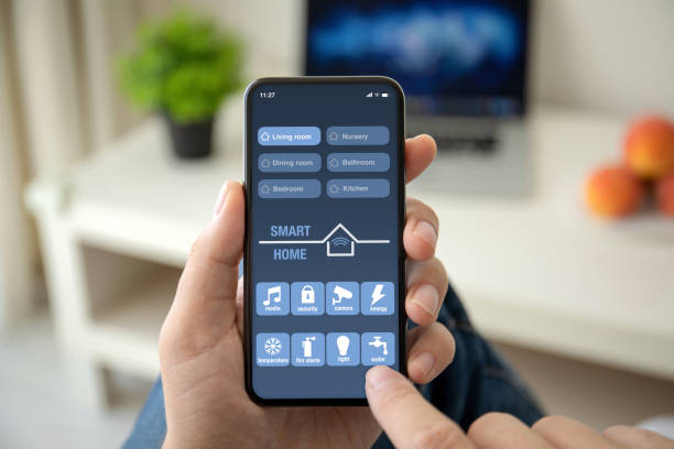 istock man hands holding phone with app smart home on screen 1150553306