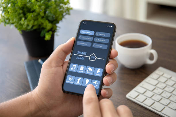 istock man hands holding phone with app smart home on screen 1150553829