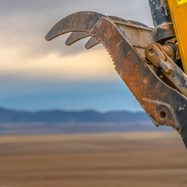 Detail of Yellow Bulldozer with sky in background\