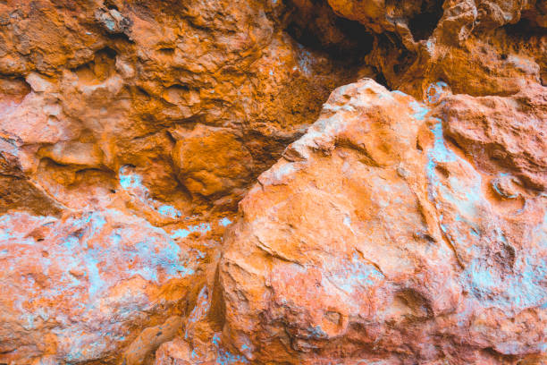 istock orange cliffs with white details and darken shadows on the top 1150554432